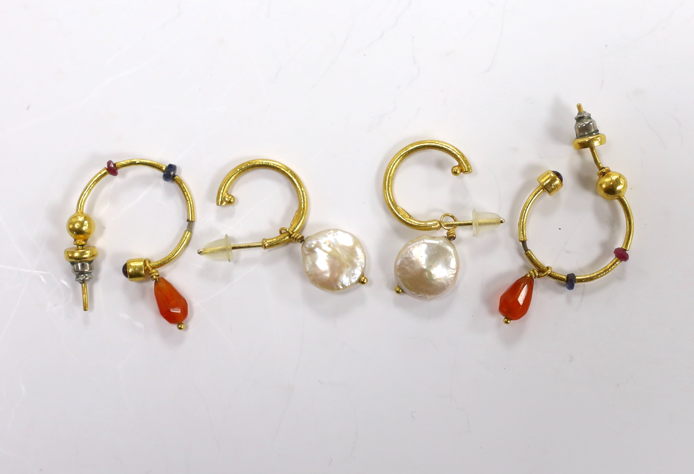 A pair of Middle Eastern 24k yellow metal and baroque cultured pearl set drop earrings, overall 31mm and one other pair of drop earrings.